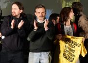 Anti-austerity party Podemos leader Pablo Iglesias (L) and candidate for Madrid's regional presidency Jose Manuel Lopez (C), pictured with supporters in Madrid on May 24, 2015