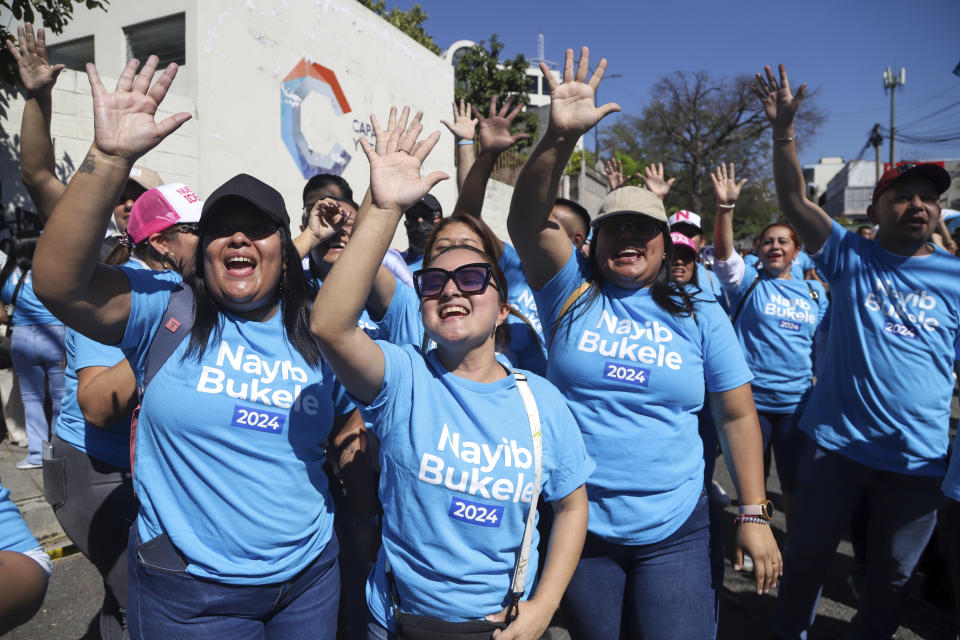 Supporters of President Nayib Bukele cheer outside the polling station where he will vote in general elections in San Salvador, El Salvador, Sunday, Feb. 4, 2024. (AP Photo/Salvador Melendez)