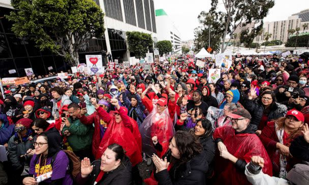 PHOTO: Los Angeles school workers protest in front of LAUSD headquarters during the first day of a walkout over contract negotiations that closes the country's second largest school system in Los Angeles, Mar. 21, 2023. (Aude Guerrucci/Reuters)