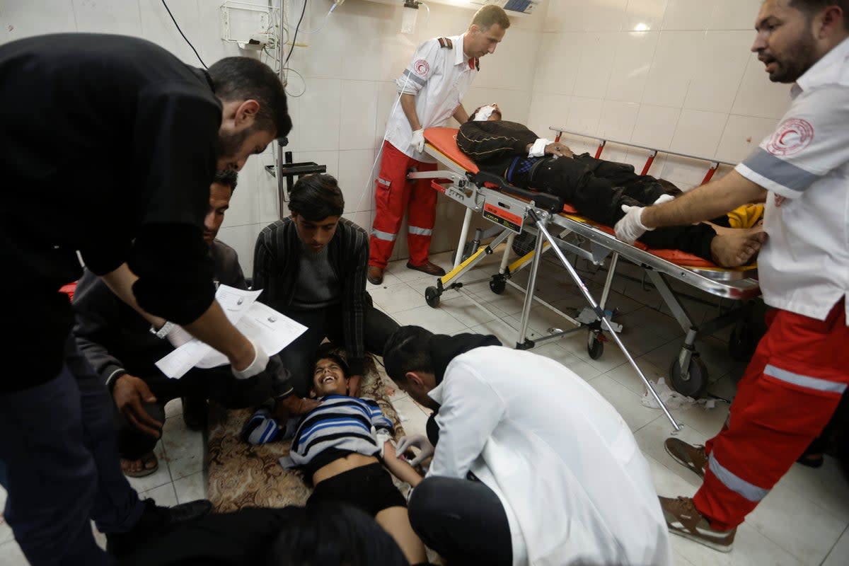 A wounded child is among those to receive treatment in hospital in Khan Younis, Gaza  (AP)