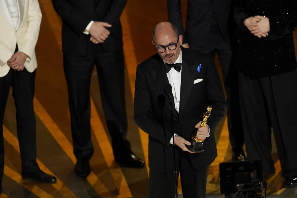 Edward Berger accepts the award for "All Quiet on the Western Front" from Germany, for best international feature film at the Oscars on Sunday, March 12, 2023, at the Dolby Theatre in Los Angeles. (AP Photo/Chris Pizzello)