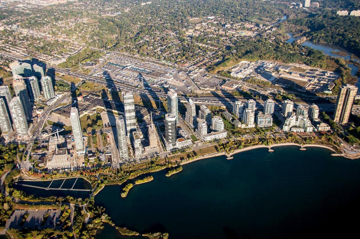 <span>An aerial view of Toronto, by the shore of Lake Ontario.</span><span>Photograph: Bloomberg/Getty Images</span>
