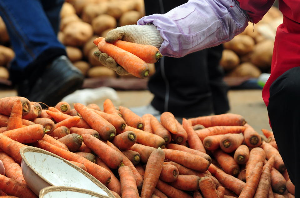 Carrots and a range of other fruits and vegetables from China now face new 10% tariffs at the US border. Photo: Frederic J Brown/Getty Images