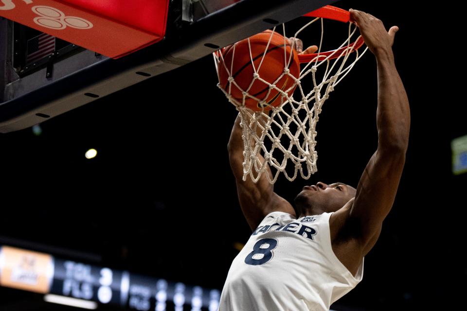 Xavier Musketeers guard Quincy Olivari (8) dunks in the second half of the NCAA basketball game Bryant Bulldogs and Xavier Musketeers at Cintas Center in Cincinnati on Friday, Nov. 24, 2023.