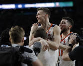Virginia's Kyle Guy celebrates after defeating Auburn 63-62 in the semifinals of the Final Four NCAA college basketball tournament, Saturday, April 6, 2019, in Minneapolis. (AP Photo/David J. Phillip)