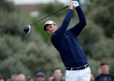 FILE PHOTO - Golf - The 146th Open Championship - Royal Birkdale - Southport, Britain - July 20, 2017 England’s Justin Rose hits his tee shot on the second hole during the first round REUTERS/Paul Childs