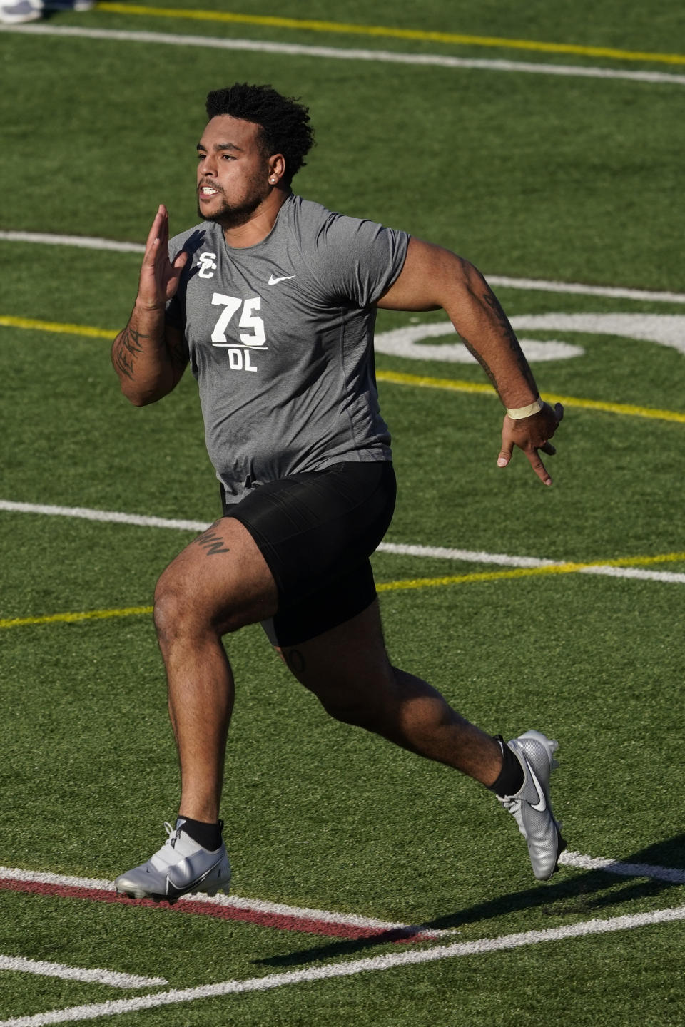 FILE - Southern California lineman Alijah Vera-Tucker participates in the school's pro day football workout for NFL scouts in Los Angeles, in this Wednesday, March 24, 2021, file photo. The Las Vegas Raiders spent the free agency period dismantling their offensive line and mostly ignoring the secondary. Now heading into the NFL draft, those are the two spots that appear to be the most urgent needs for the Raiders to fill starting with pick No. 17 in the first round. (AP Photo/Marcio Jose Sanchez, File)