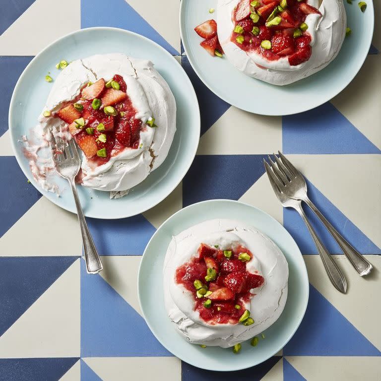 a close up of meringues with strawberry rhubarb compote