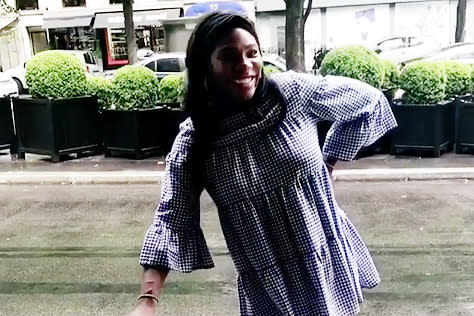 Pregnant Serena Williams does a rain dance in cute gingham dress