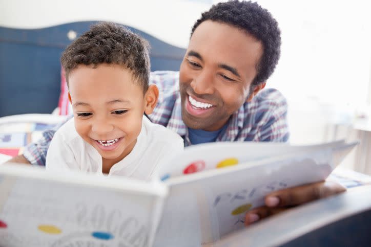 summer activities dad and son reading together