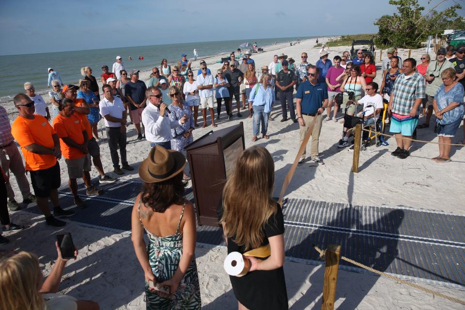 A large group of people celebrated the reopening of Lighthouse BEach Park on Sanibel Island in June.