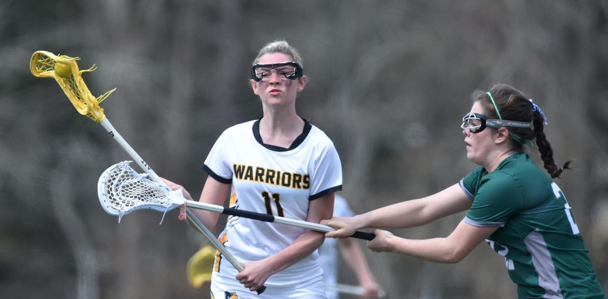 D-Y's Tessa Hinds tries to slow down Nauset's Coral Punch.