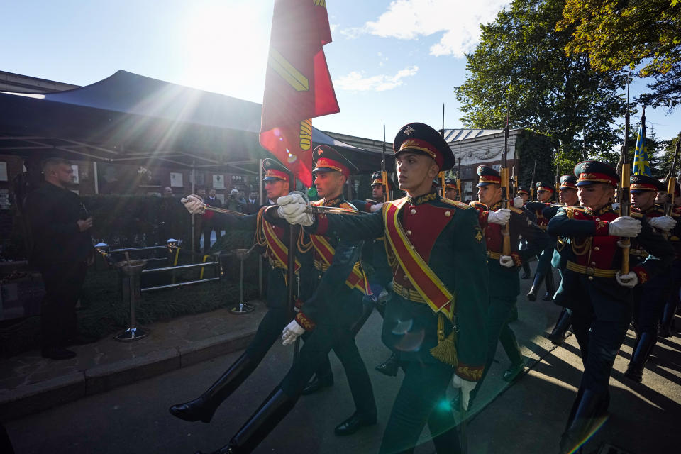 Honor guards march past the grave of Soviet President Mikhail Gorbachev during his funeral at Novodevichy Cemetery in Moscow, Russia, Saturday, Sept. 3, 2022. (AP Photo/Alexander Zemlianichenko, Pool)