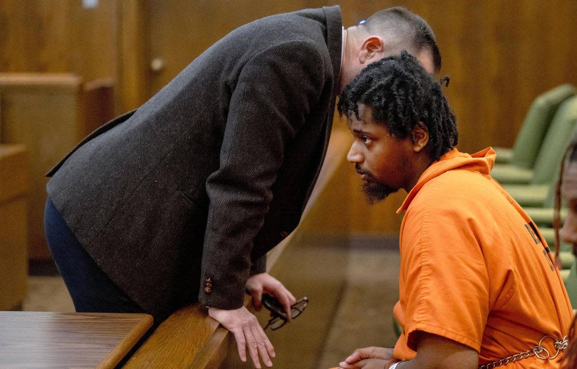 Lyndell Mays, one of the men charged with murder in the Kansas City Chiefs Super Bowl rally mass shooting, listens to his public defender, John Reed, before a bond hearing in Jackson County Circuit Court on Tuesday, March 5, 2024, in Kansas City.