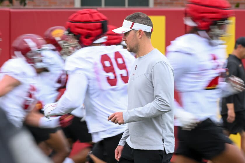 LOS ANGELES, CA - AUG. 5, 2022: USC head coach Lincoln Riley watches his players warm up during the first day of fall training camp at USC. (Michael Owen Baker / For The Times)