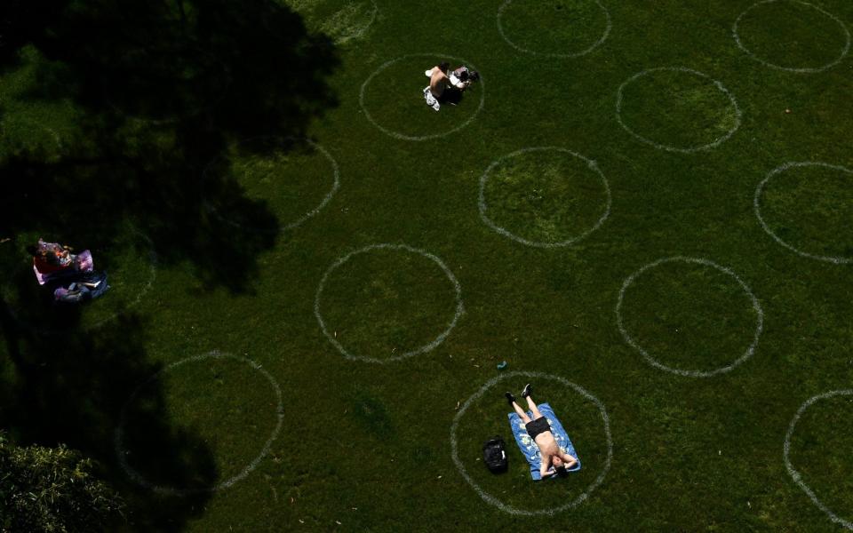 People relax at Circular Quay after picnic restrictions were lifted in Sydney - JOEL CARRETT/EPA-EFE/Shutterstock