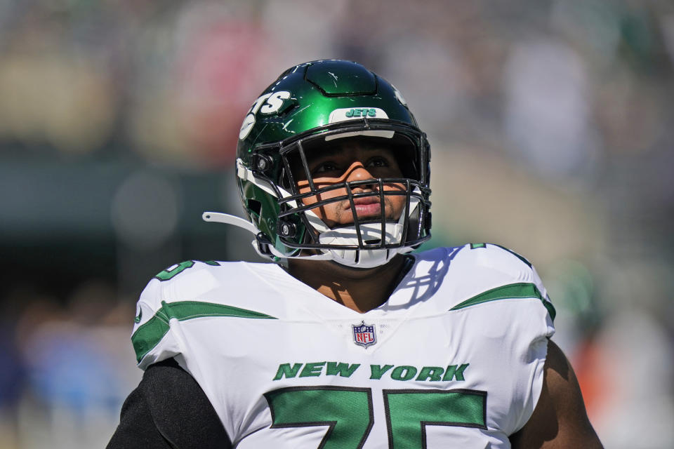 New York Jets' Alijah Vera-Tucker warms-up before an NFL football game against the New England Patriots, Sunday, Sept. 19, 2021, in East Rutherford, N.J. (AP Photo/Frank Franklin II)