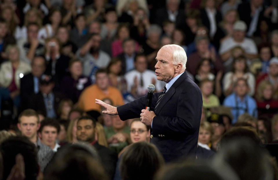 Republican presidential candidate Sen. John McCain addresses a town hall meeting in Lakeville, Minn., in October 2008. He urged his supporters to stop hurling abuse at Barack Obama at his rallies, saying he admired and respected his Democratic rival. (Photo: Jim Watson/AFP/Getty Images)