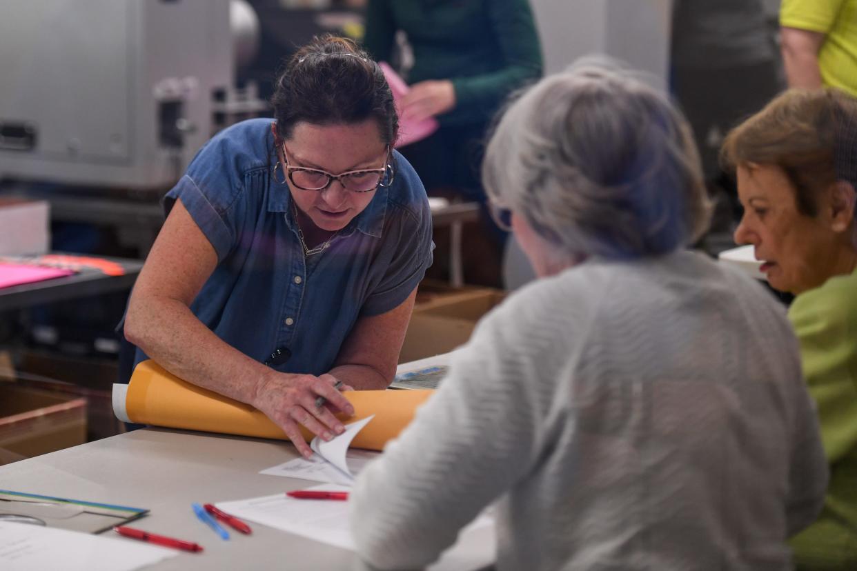 Minnehaha county auditor Leah Anderson assists ballot counters during primary day on Tuesday, June 4, 2024, at the Minnehaha County Administration building in Sioux Falls.