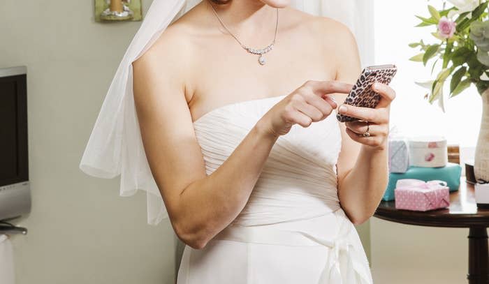 A bride texting on her phone