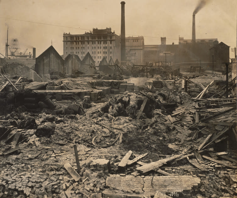 <span class="caption">General view of sheds, Royal Victoria Dock after the blast.</span> <span class="attribution"><span class="source">© Museum of London / PLA Collection</span></span>