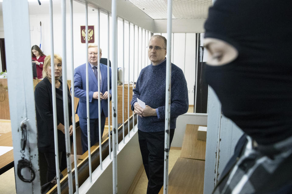 Paul Whelan, a former U.S. Marine, center, who was arrested in Moscow at the end of last year, waits for a hearing in a court in Moscow, Russia, Friday, May 24, 2019. The American was detained at the end of December for alleged spying. (AP Photo/Pavel Golovkin)