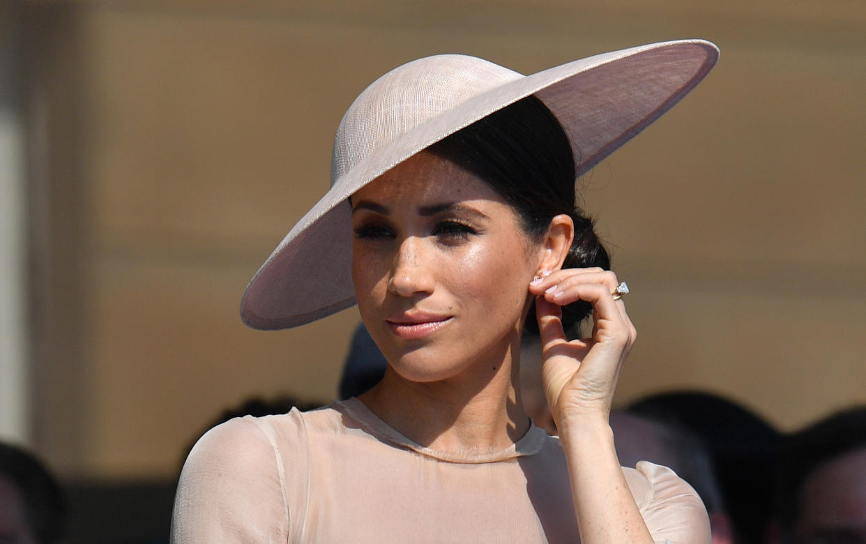 Britain's Meghan, Duchess of Sussex, attends the Prince of Wales's 70th Birthday Garden Party at Buckingham Palace in London on May 22, 2018. - The Prince of Wales and The Duchess of Cornwall hosted a Garden Party to celebrate the work of The Prince's Charities in the year of Prince Charles's 70th Birthday. (Photo by Dominic Lipinski / POOL / AFP)        (Photo credit should read DOMINIC LIPINSKI/AFP via Getty Images)