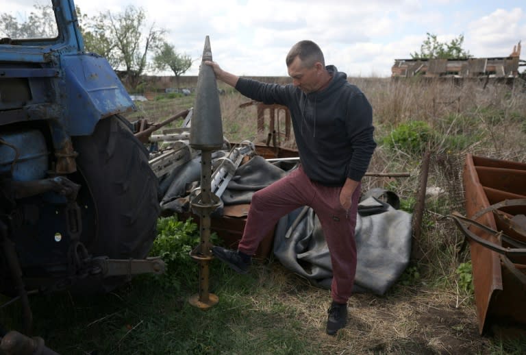 Ukrainian farmer Igor Kniazev has discovered the remains of shells and rockets on his land (Anatolii STEPANOV)