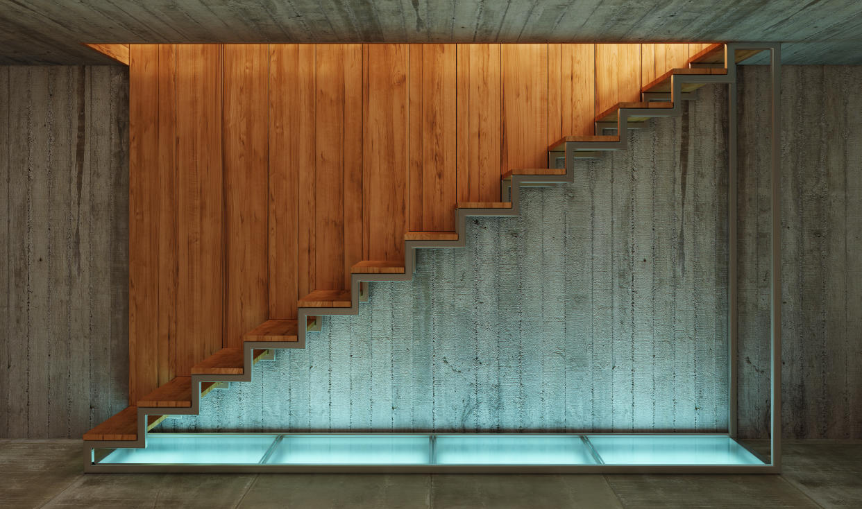 Home renovation wooden stairs Converting your basement into a guest suite, utility room, playroom or extra bathroom could add value to your property. Photo: Getty