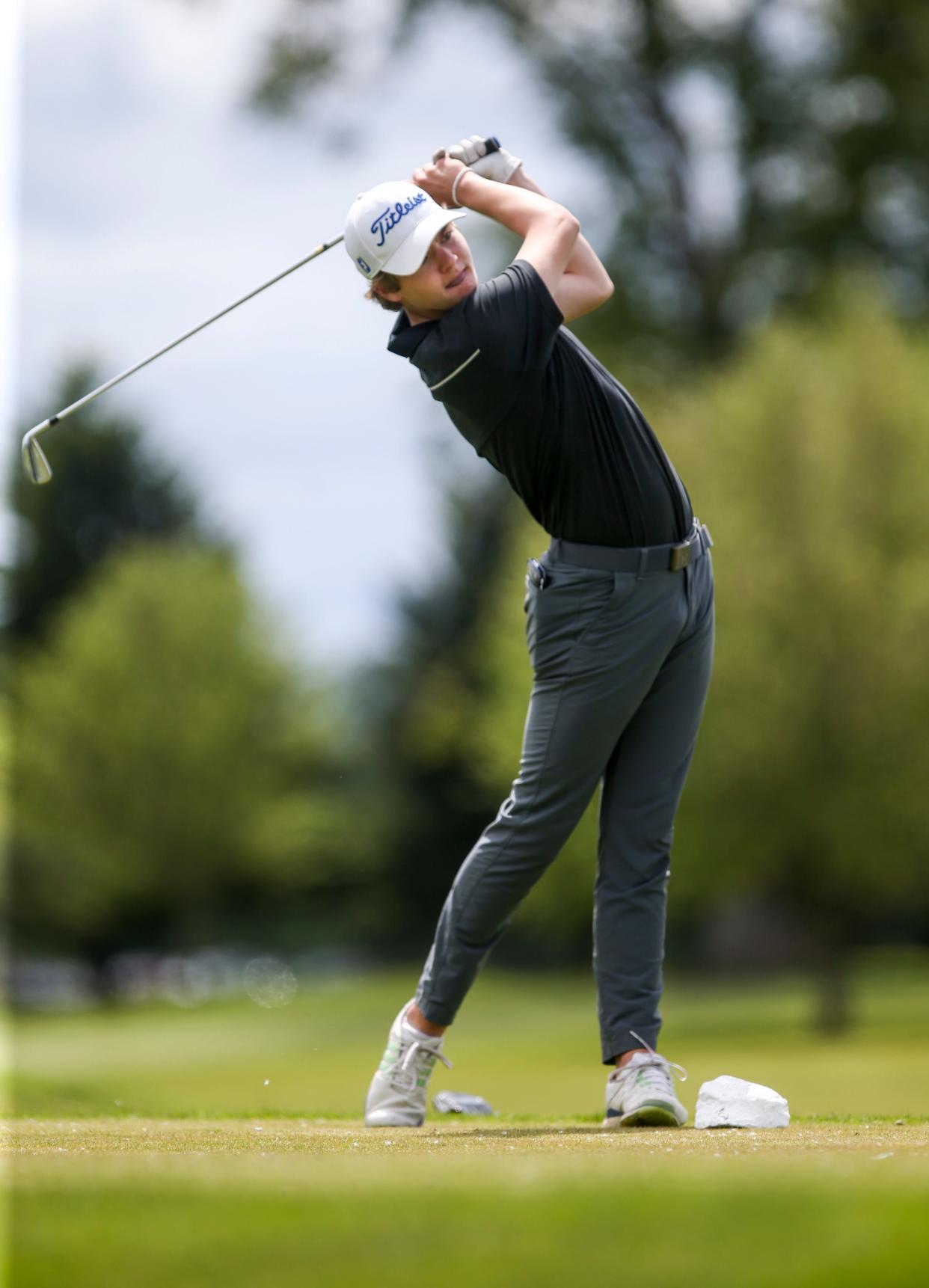 McNary's Elijah Clendening drives the ball during the 6A boys state golf championship on Monday, May 16, 2022 at Trysting Tree Golf Club in Corvallis, Ore.