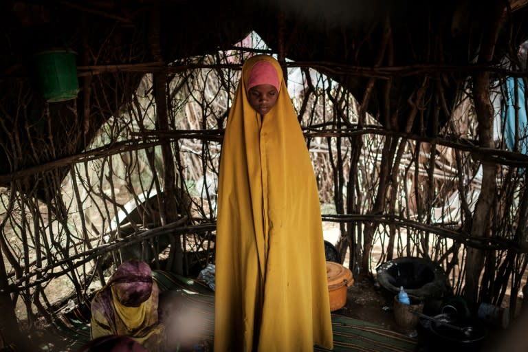 A Somali girl stands in a makeshift shelter in the refugee complex, first established in 1992 after civil war broke out in Somalia