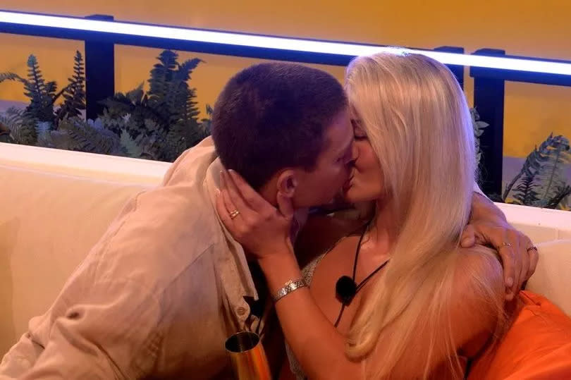 Joey and Grace snogging