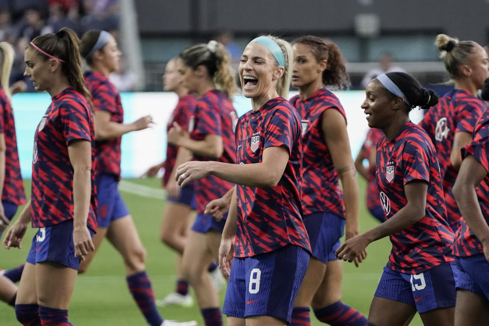 U.S. midfielder Julie Ertz, center, laughs while warming up with teammates before an international friendly soccer match against South Africa, Thursday, Sept. 21, 2023, in Cincinnati. (AP Photo/Joshua A. Bickel)