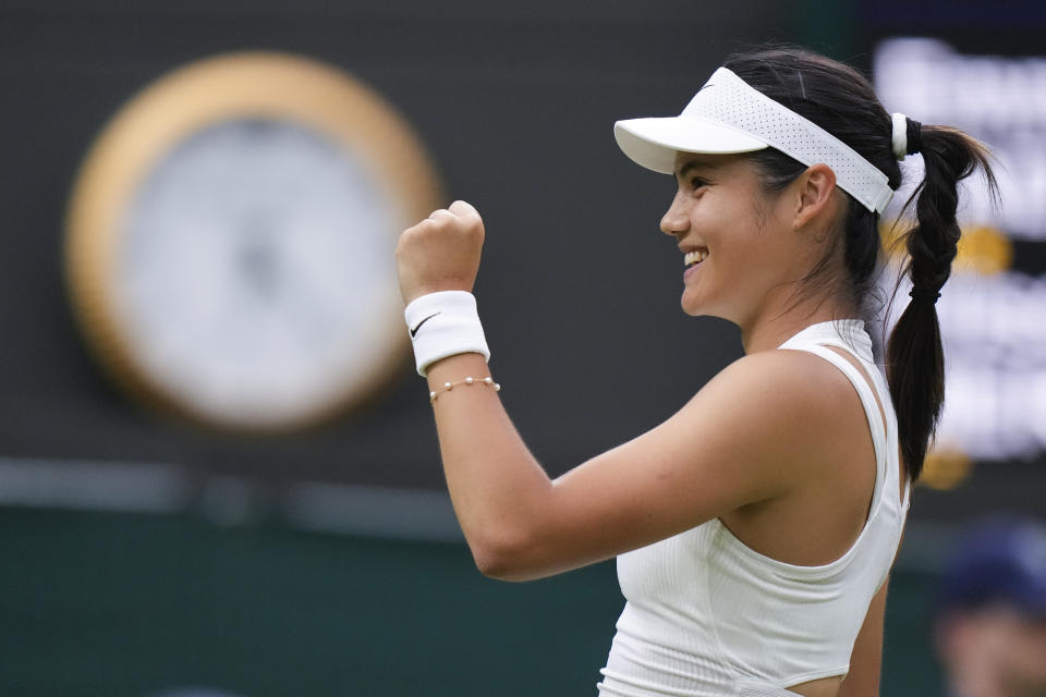 Emma Raducanu of Britain celebrates after defeating Elise Mertens of Belgium in their match on day three at the Wimbledon tennis championships in London, Wednesday, July 3, 2024. (AP Photo/Mosa'ab Elshamy)