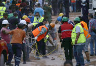 <p>Volunteers and rescue personnel work on the remains of a collapsed primary school after a 7.1 earthquake struck Mexico City, Tuesday, Sept. 19, 2017. (Photo: Marco Ugarte/AP) </p>