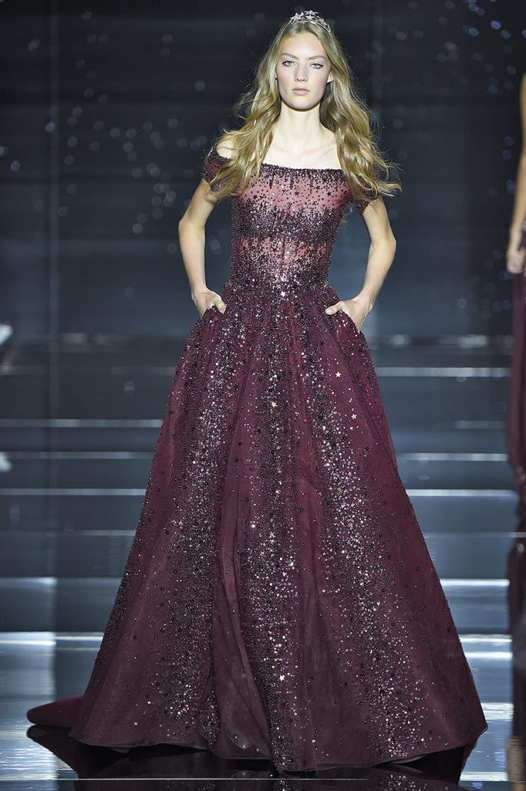 A model walks the runway in the dress Adele is wearing on tour. (Photo by Victor VIRGILE/Gamma-Rapho via Getty Images)