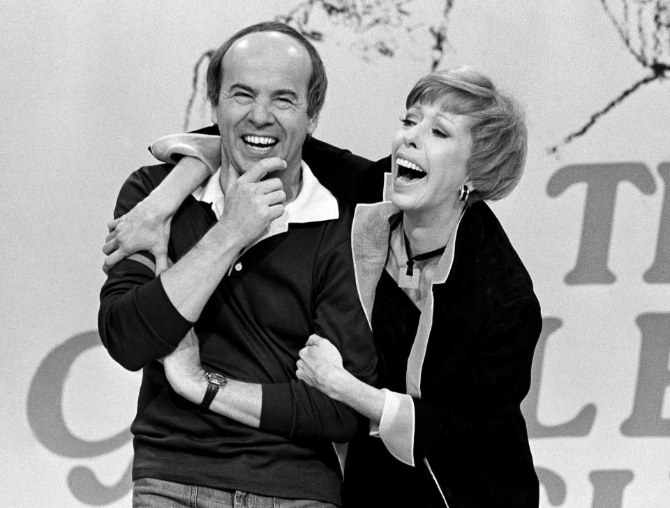 Comedian Carol Burnett laughs with co-star Tim Conway during the taping of the final episode of "The Carol Burnett Show" in Los Angeles on March 19, 1978. Conway, who won four Emmy Awards on the TV variety show, starred in "McHale's Navy" and later voiced the role of Barnacle Boy for "Spongebob Squarepants," died on May 14. He was 85. (AP Photo/ George Brich)
