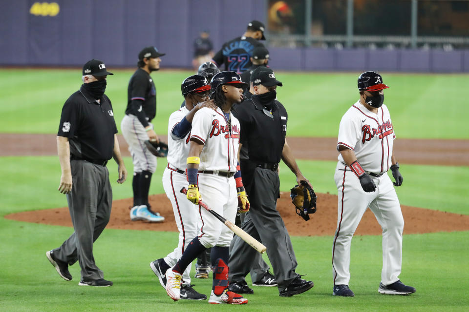 Ronald Acuna Jr. reacts after being hit by a Sandy Alcantara pitch during Game 1 of the NLDS. (Photo by Bob Levey/Getty Images)