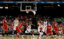 NEW ORLEANS, LA - MARCH 31: Thomas Robinson #0 of the Kansas Jayhawks and Aaron Craft #4 of the Ohio State Buckeyes go after a loose ball in the second half during the National Semifinal game of the 2012 NCAA Division I Men's Basketball Championship at the Mercedes-Benz Superdome on March 31, 2012 in New Orleans, Louisiana. (Photo by Jeff Gross/Getty Images)