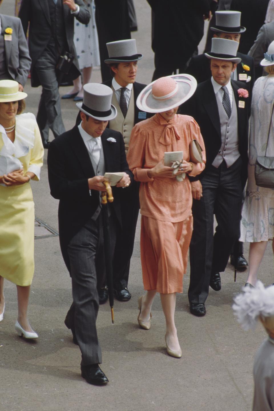 Diana, Princess of Wales (1961 - 1997) and Prince Andrew at Ascot racecourse in England, June 1985. She is wearing a suit by Jan Van Velden and a hat by Frederick Fox. (Photo by Jayne Fincher/Princess Diana Archive/Getty Images)