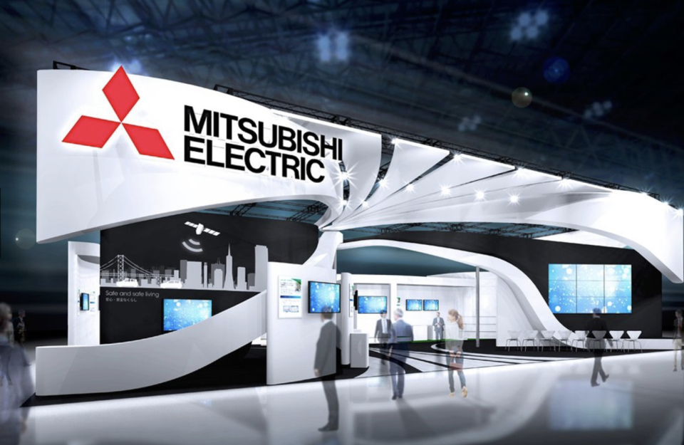 La Mitsubishi Electric Corporation nasce nel 1870 in seguito allo scorporo dello stabilimento di produzione di motori elettrici per navi transoceaniche della Mitsubishi Shipbuilding Co. (oggi Mitsubishi Heavy Industries) sito a Kobe, in Giappone. Negli anni Trenta, Mitsubishi Electric comincia a fabbricare, installare e curare la manutenzione di ascensori e scale mobili e a produrre apparecchiature per la generazione di energia. Nel 1960 è già affermata come una delle più innovative aziende produttrici di apparecchiature elettriche del Giappone. Oggi Mitsubishi Electric è una multinazionale con sedi in 40 Paesi: tra le aziende del gruppo c'è anche la Nikon Corporation (o Nikon, Nikon Corp.), fondata nel 1917 e leader nel settore della fotografia e dell'ottica.