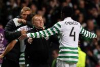 Celtic manager Neil Lennon celebrates at the final whistle during their UEFA Champions League Group G football match at Celtic Park in Glasgow. Celtic sent shockwaves around Europe as they produced a stunning 2-1 Group G win over Barcelona at Parkhead on Wednesday to end the Catalan giants' 100 per cent record in this season's competition