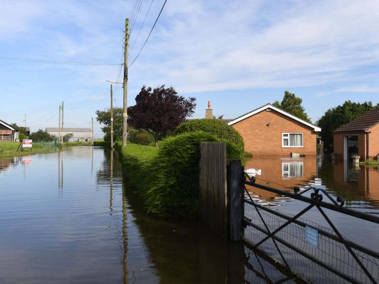 Hundreds of families face spending days away from their homes after being evacuated following severe flooding in Lincolnshire.Thunderstorms are expected to bring further heavy rain over the coming week as government agencies battle to pump out excess water from the Wainfleet area.Around 130 homes were flooded after the River Steeping burst its banks last week, leading to the evacuation of around 590 properties in total by Saturday afternoon.RAF Chinook helicopters have dropped more than 330 one-tonne sandbags in an attempt to repair the riverbank and police drones are monitoring the area to look out for any further breaches of flood defences.The Environment Agency installed two ”Ultra High Volume” pumps to help remove water from the affected areas.But it also warned that there was an increased risk of flooding between Tuesday, Wednesday and Thursday due to new Met Office weather warnings covering the east Midlands. Forecasters are predicting up to 50mm of rain in some areas, with between 15mm to 30mm over the wider region. It comes on top of the 132mm - more than two months worth of rain – between 10 and 12 June, described by the Environment Agency as an “unprecedented event”.“River levels are expected to remain very high for the next few days,” the agency said in a statement. ”Our staff are out in the area assisting the military, emergency services and council. “Military aid has assisted in stemming the flow from the river. The repair is still holding and we’re still out on the ground today. Remain safe and be aware of your local surroundings.”Lincolnshire Police initially told residents they should be prepared to be away from their homes for around 48 hours – but the risk of further flooding may extend this until Friday.Local MP Matt Warman said environment secretary Michael Gove had assured him officials would “have access to every resource they need regardless of cost” to protect lives and homes.He added: “In terms of the response, we have seen an incredible working together of the agencies. Local people should keep an eye on the police updates because there is still the potential for risk to homes and lives. But in the long term, it will always just be a huge thank you.” Lincolnshire Police have issued a list of nearly 100 postcode in the PE23 and PE24 area where evacuations are possible.In its latest update on Sunday afternoon, the force advised people in Wainfleet not to use their washing machines, toilets or showers and suggested they use portable facilities set up in the town.A total of 13 flood warnings and 23 flood alerts are in force across the country, according to the Environment Agency website.Additional reporting by Press Association