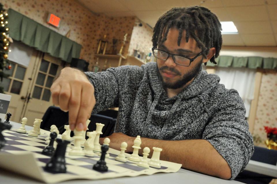 Elvin Monteiro, of Dorchester, prepares to move a piece during the first night of the Quincy Chess Club at Bethany Congregational Church in Quincy on Wednesday, Jan. 3, 2024.