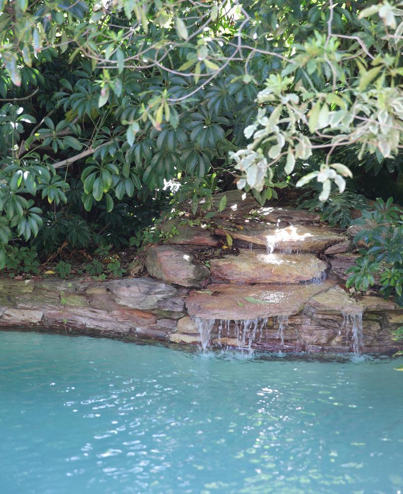 A natural rock waterfall into the pool provides 'white noise' that disguises the sound of neighbours. Picture: Robert Duncan