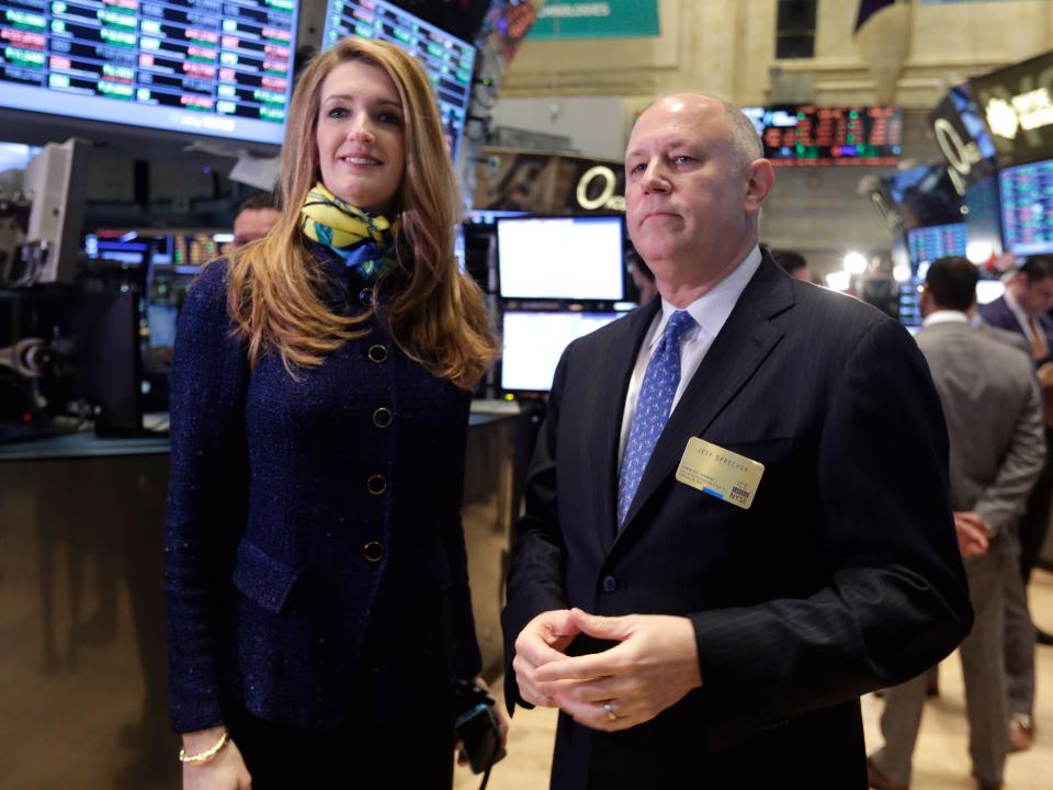 Intercontinentalexchange Chairman and CEO Jeffrey Sprecher, and ICE Vice President of Corporate Affairs Kelly Loeffler visit the floor of the New York Stock Exchange Monday, Nov. 18, 2013.  (AP Photo/Richard Drew)