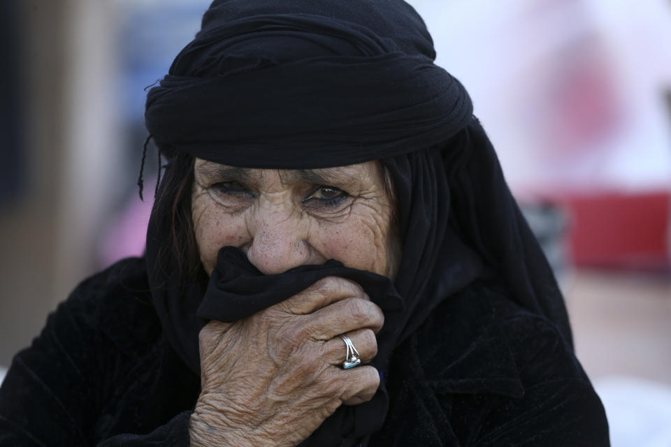 <p>An earthquake survivor weeps in front of her house in a compound which was built under the Mehr state-owned program, in Sarpol-e-Zahab in western Iran, Nov. 14, 2017.(Photo: Vahid Salemi/AP) </p>