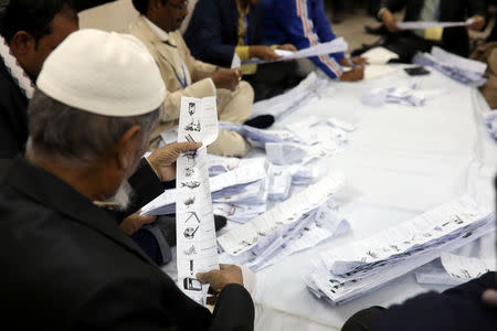 A presiding officer counts votes at a voting center after the session has ended in Dhaka, Bangladesh, December 30, 2018. REUTERS/Mohammad Ponir Hossain