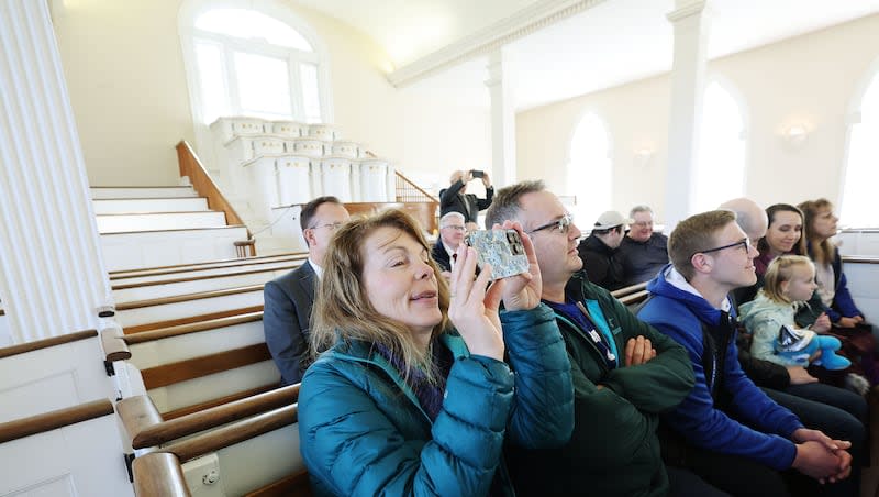 Margaret Iverson of Preston, Idaho, takes a photo during a tour of the Kirtland Temple in Kirtland, Ohio, on Monday, March 25, 2024.