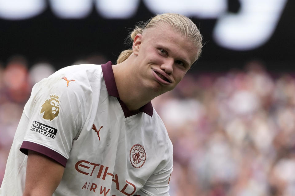 Manchester City's Erling Haaland reacts after scoring his side's third goal during the English Premier League soccer match between West Ham United and Manchester City at London stadium in London, Saturday, Sept. 16, 2023. (AP Photo/Kin Cheung)